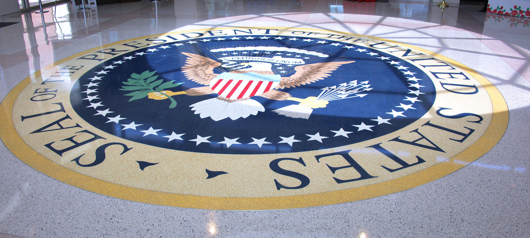 Photo of US Presidential Seal on a lobby floor